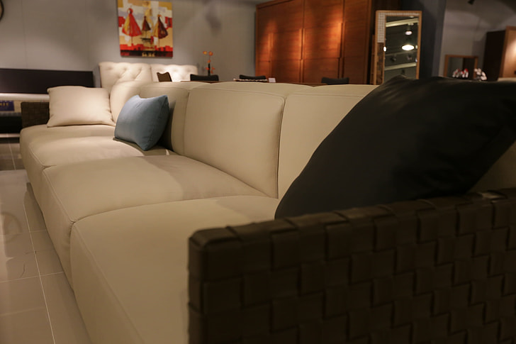 photography of a white leather couch