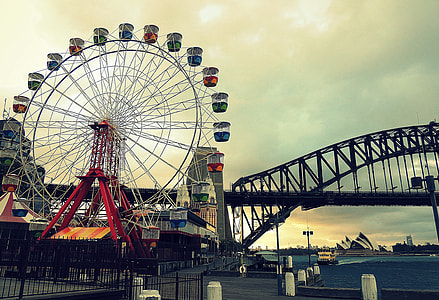 photography of Ferris wheel near bridge