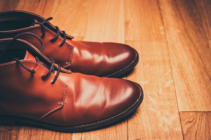 pair of brown leather chukka boots