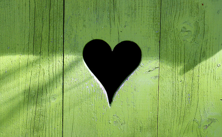 green wooden heart-cutout decor