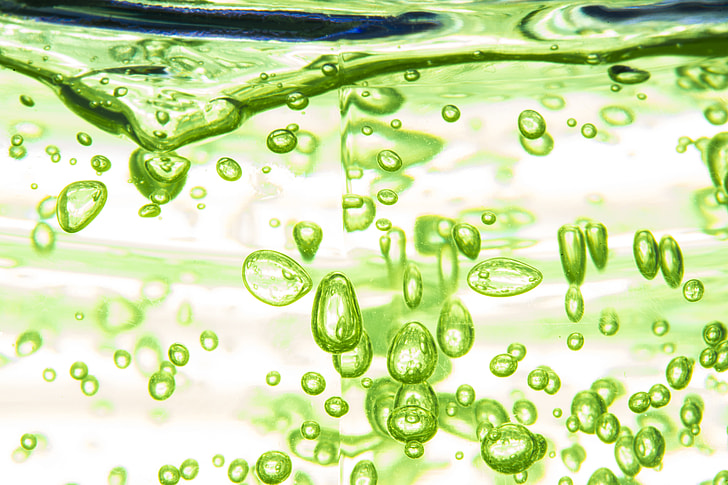 green liquid in macro lens photo