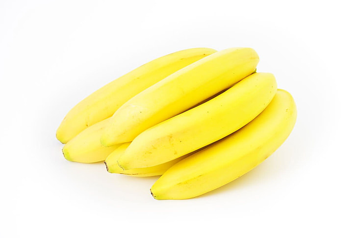yellow bananas on white surface