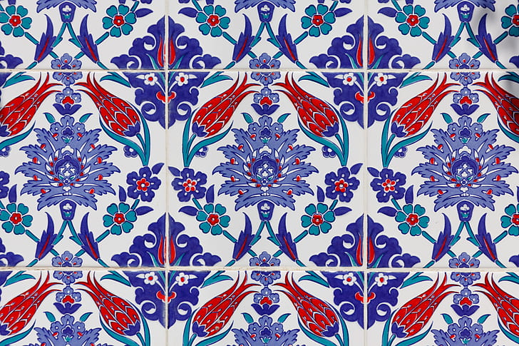 close up photo of purple and red floral tiles