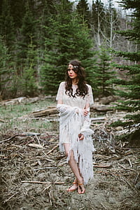 women's white knit short-sleeved dress standing near tree