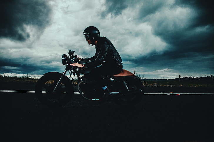 Man riding his motorbike on the road