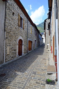 Gray Pathway Surrounded by Houses