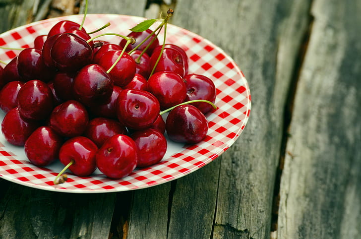 red cherries on plate