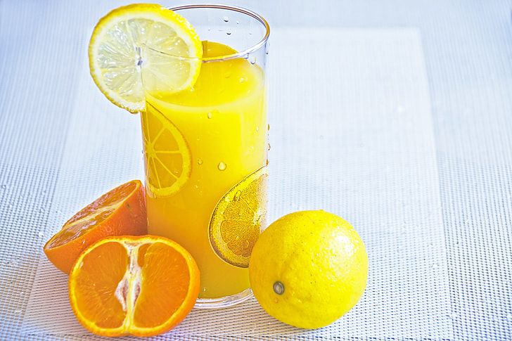 closeup photo of orange juice with fruit