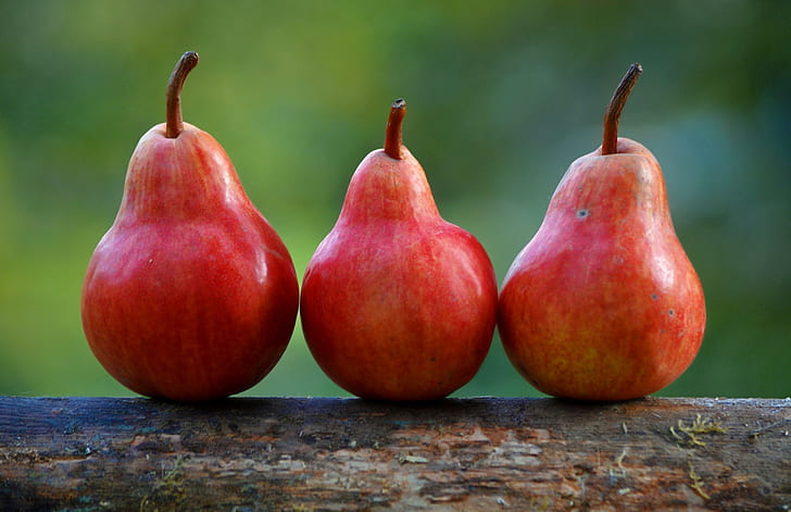 three red pear fruits