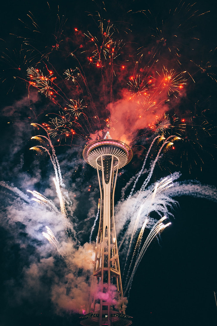 Space Needle with fireworks during night time