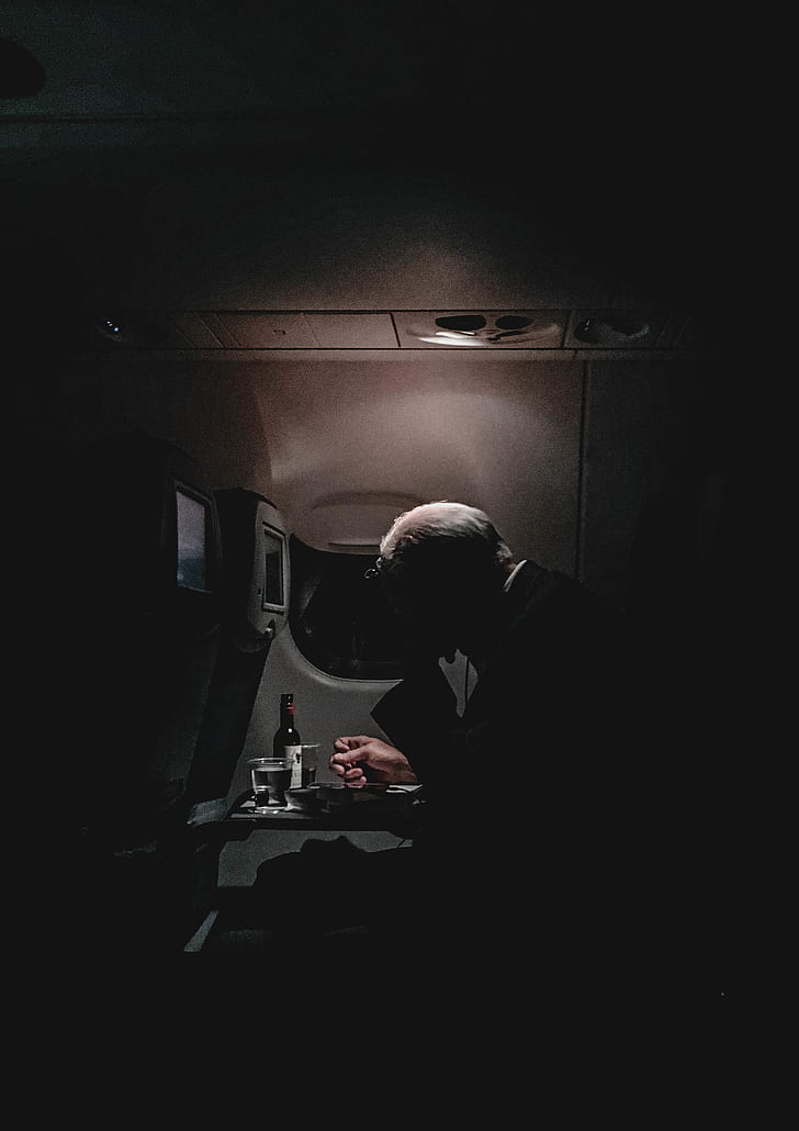 man sitting inside the plane photo