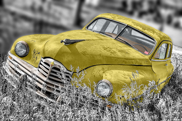 selective focus photograph of yellow car