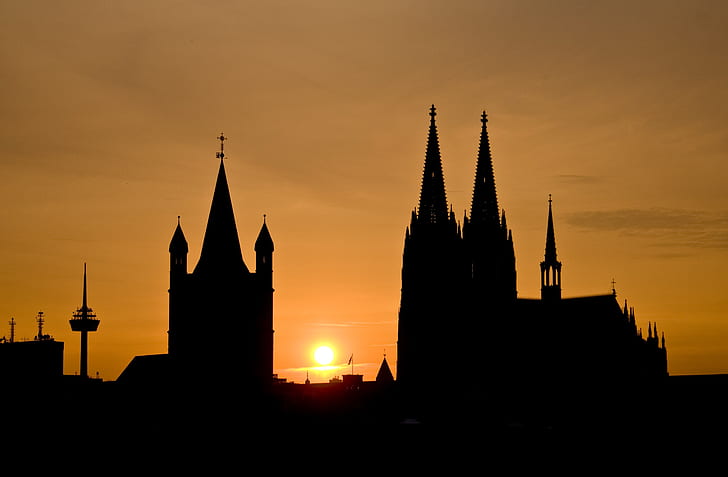 silhouette of cathedral with sunset background