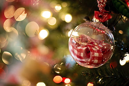 clear glass bauble with red ribbon