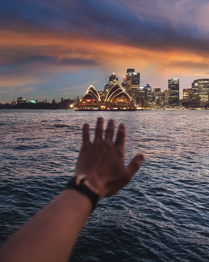 photo of person reaching Sydney, Opera House