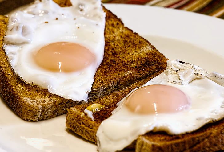 two sunny sideup egg on brown breads