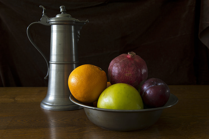 gray bowl of fruits and teapot