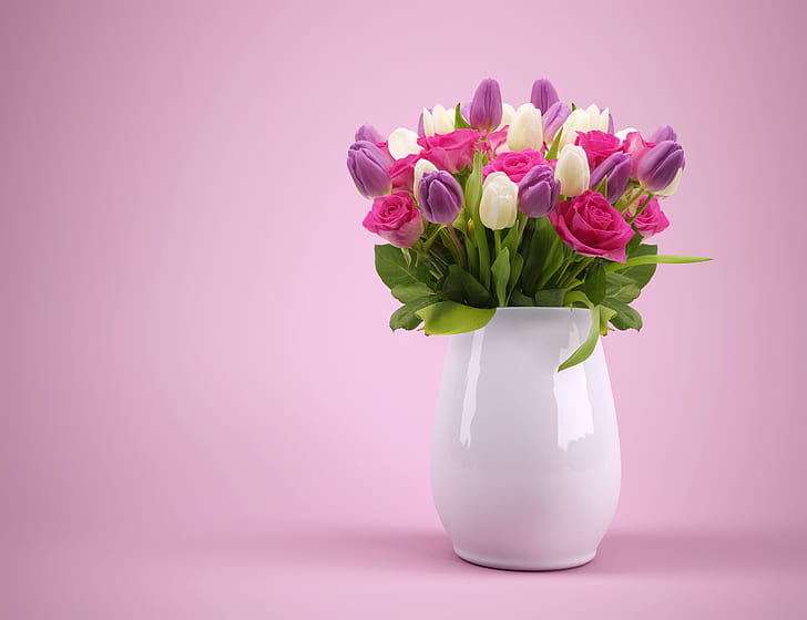 bouquet of purple, pink, and white petaled flowers in white ceramic vase