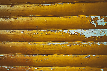 Cracked yellow paint on wood