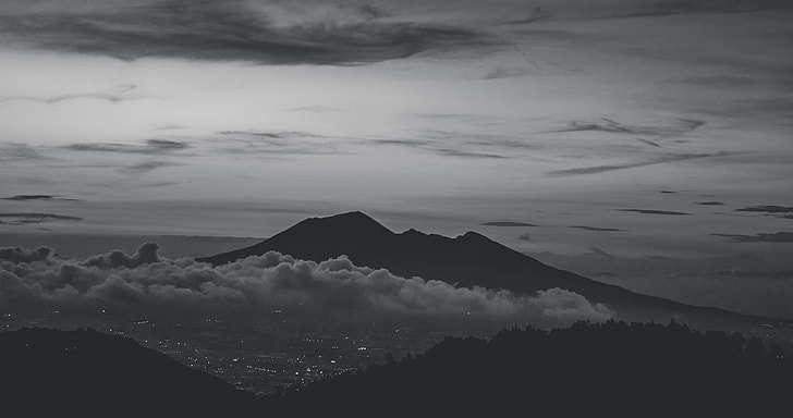 aerial grayscale photo of volcano during cloudy day