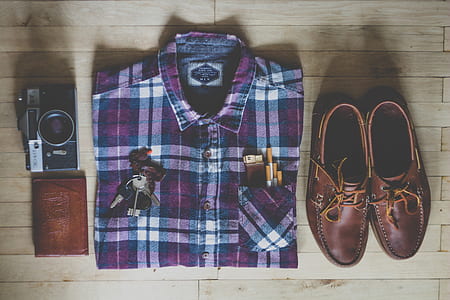 purple, white, and black button-up collard tops, pair of brown leather boat shoes, assorted keys and brown leather wallet