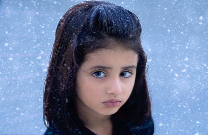girl outside during snow storm photography