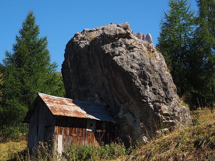 shed beside rock boulder