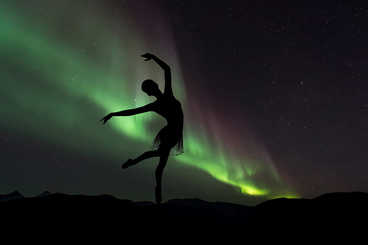 silhouette photography of ballet dancer in northern lights