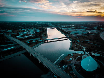 aerial photography of bridge above body of water during golden hour