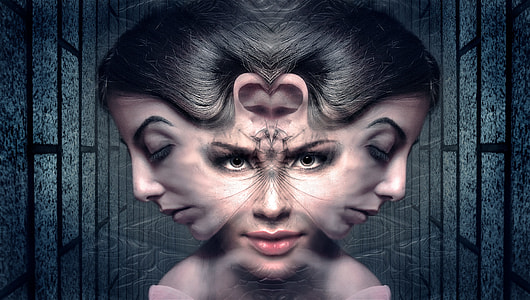 woman's mirrored-image portrait photo