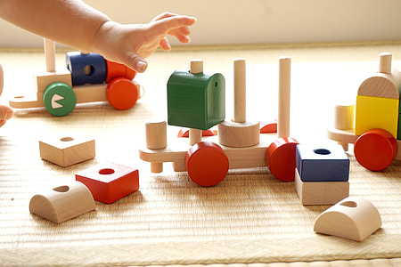 brown, red, and green wooden building blocks