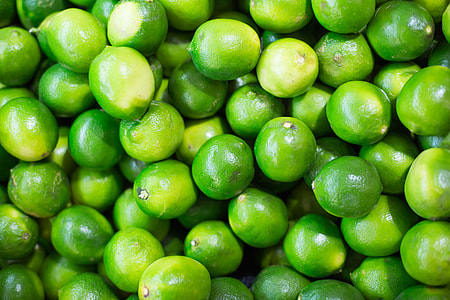 Pile of Green Limes on Market Pattern