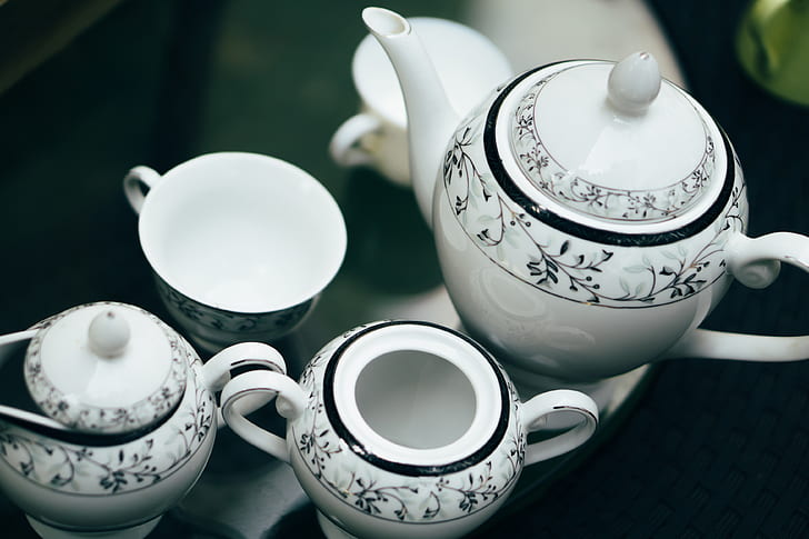 white-and-black floral ceramic tea set