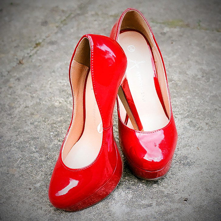 photo of pair of red patent leather platform heeled shoes