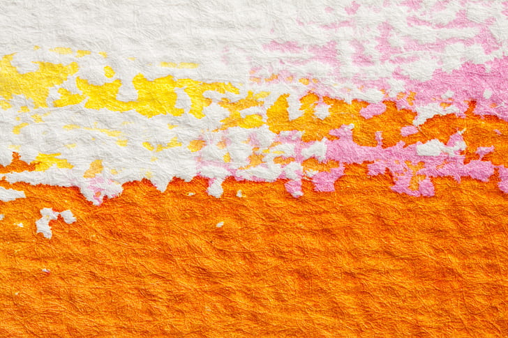 orange, white, and pink textile