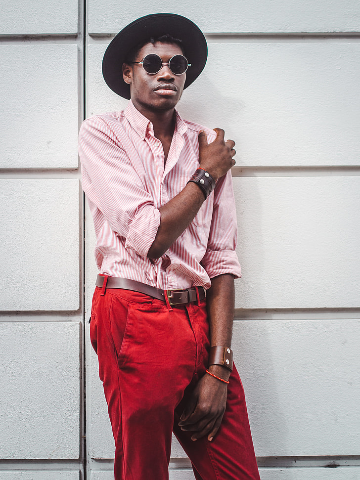 Royalty-Free photo: Man in fedora hat, pink pinstripe dress shirt, and red  denim bottoms outfit | PickPik