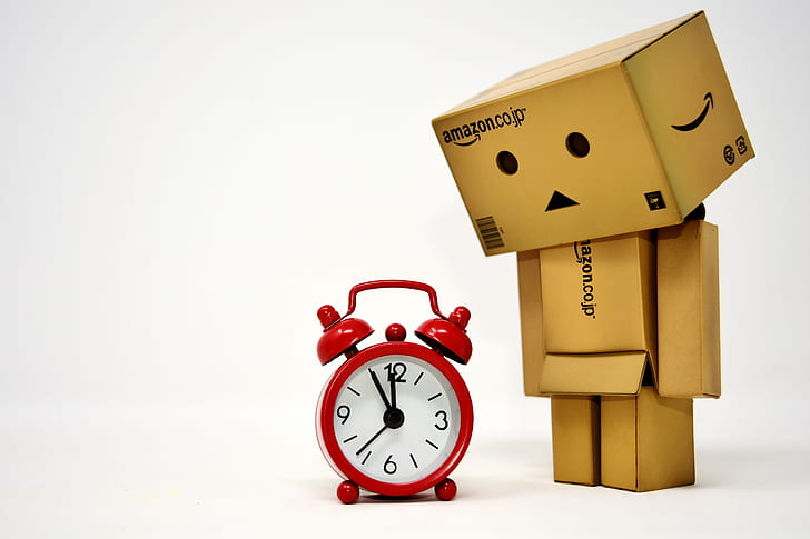 Amazon box looking at alarm clock illustration