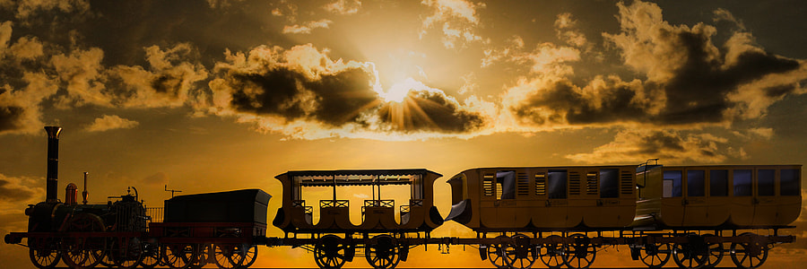 photography of brown train under golden sun