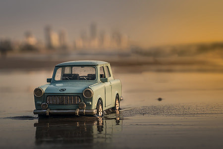 A miniature car on the beach