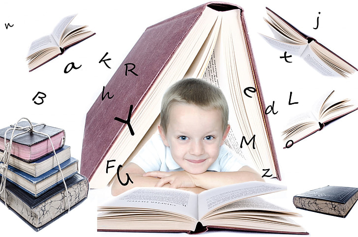 boy in white shirt with books