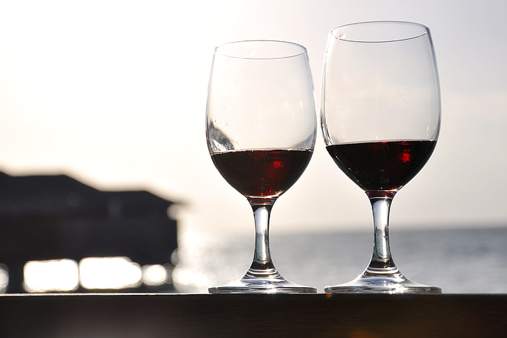 focus photography of long-stemmed wine glasses