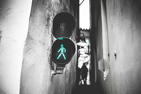 Green Traffic Light Walk Signal in Prague Narrowest Street