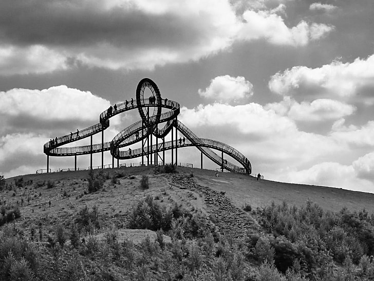 gray roller coaster grayscale photo