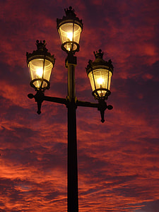 3-light outdoor lantern under cloudy sky