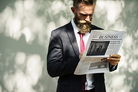 man holding Business newspaper print