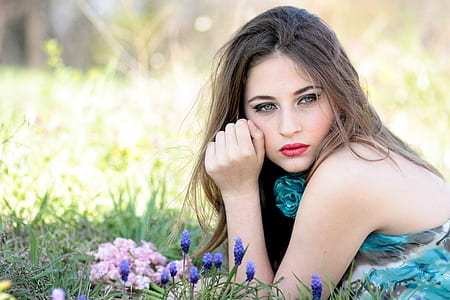 woman wearing floral tank top on grass