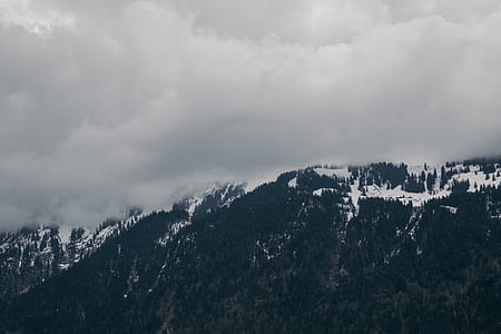 Snow-capped Mountain Under Cloudy Sky