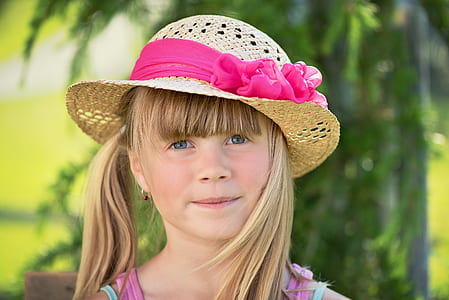 portrait photography of blonde haired with brown sun hat