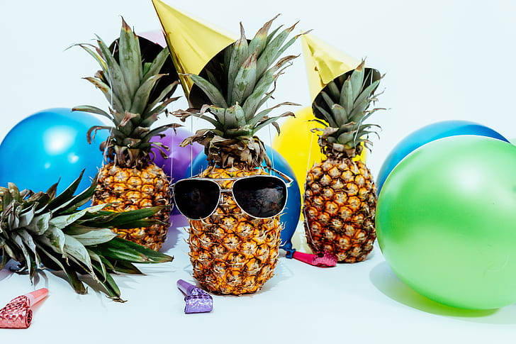 black sunglasses on pineapple