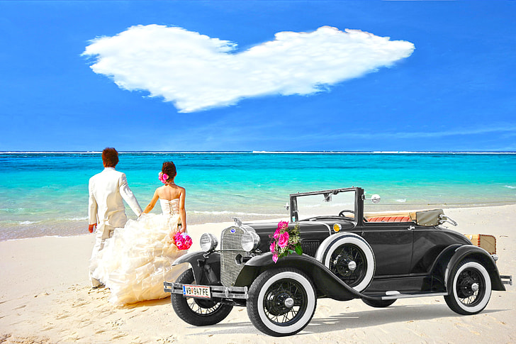 bride and groom beside black car on the beach photography